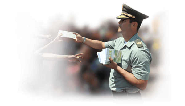 giving out The Way to Happiness booklets
